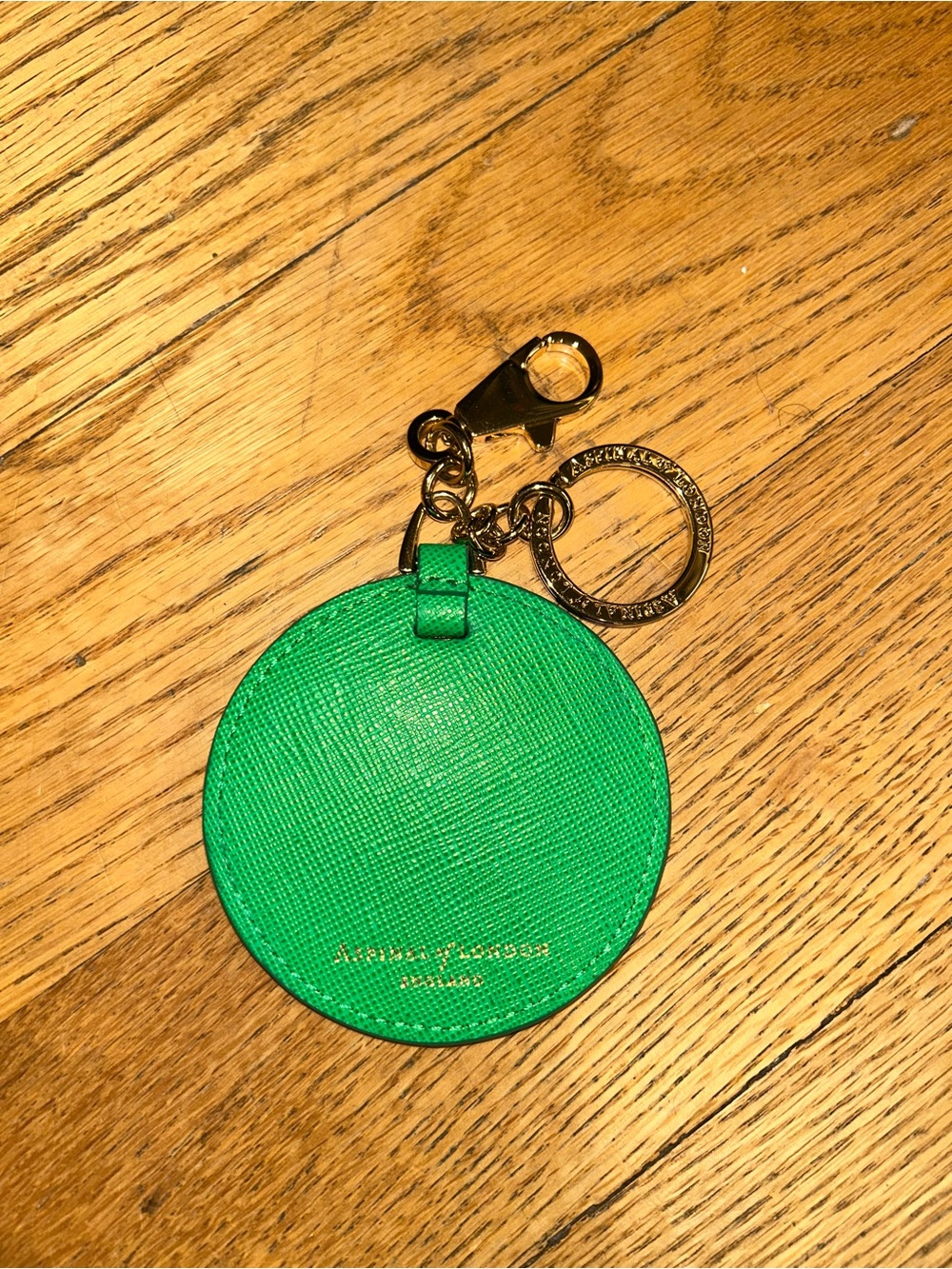 A spinal of London Round Leather Keychain Charm